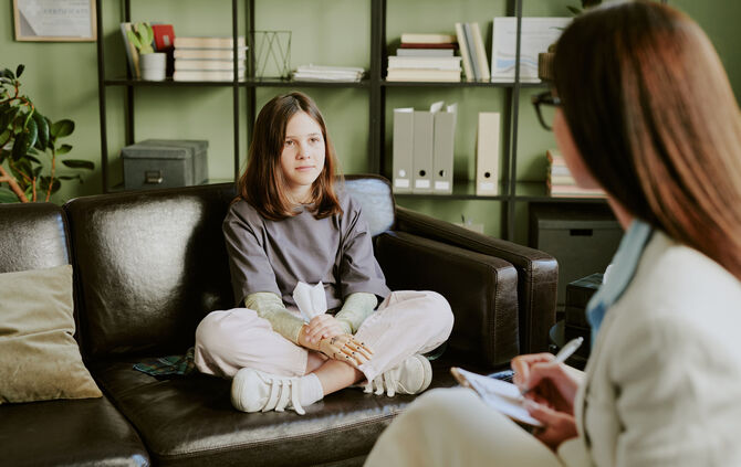 Child Receiving Counseling Session in Office Setting