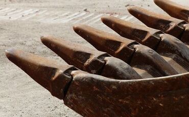 Bagger Baustelle Baggerschaufel Symbol Symbolbild Symbolfoto