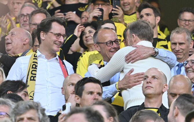 Friedrich Merz (Mitte) und Hans-Joachim Watzke