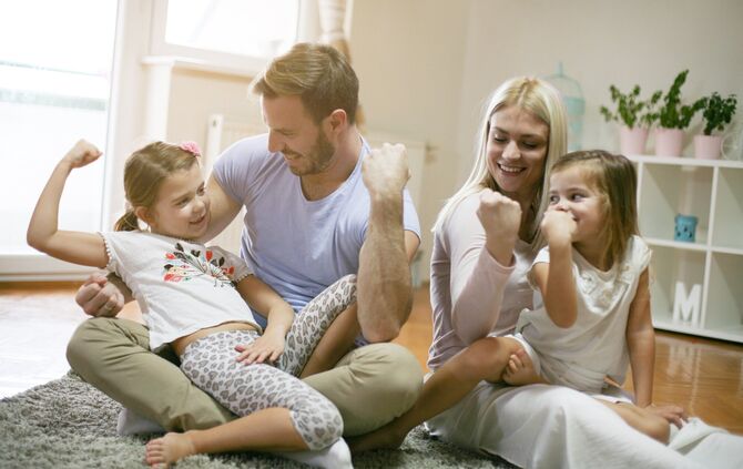 Family playing on floor.
