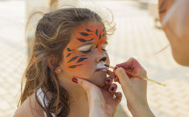 Girl,Getting,Her,Face,Painted,By,Painting,Artist.,Outdoor,Children